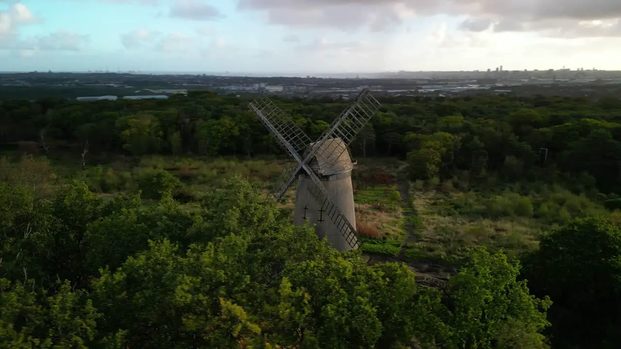 Bidston Windmill at dawn aerial drone clockwise pan sun kissed and beautiful