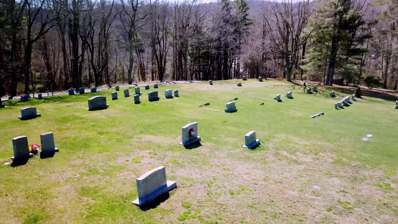 Aerial pullout of tombstone in cemetery