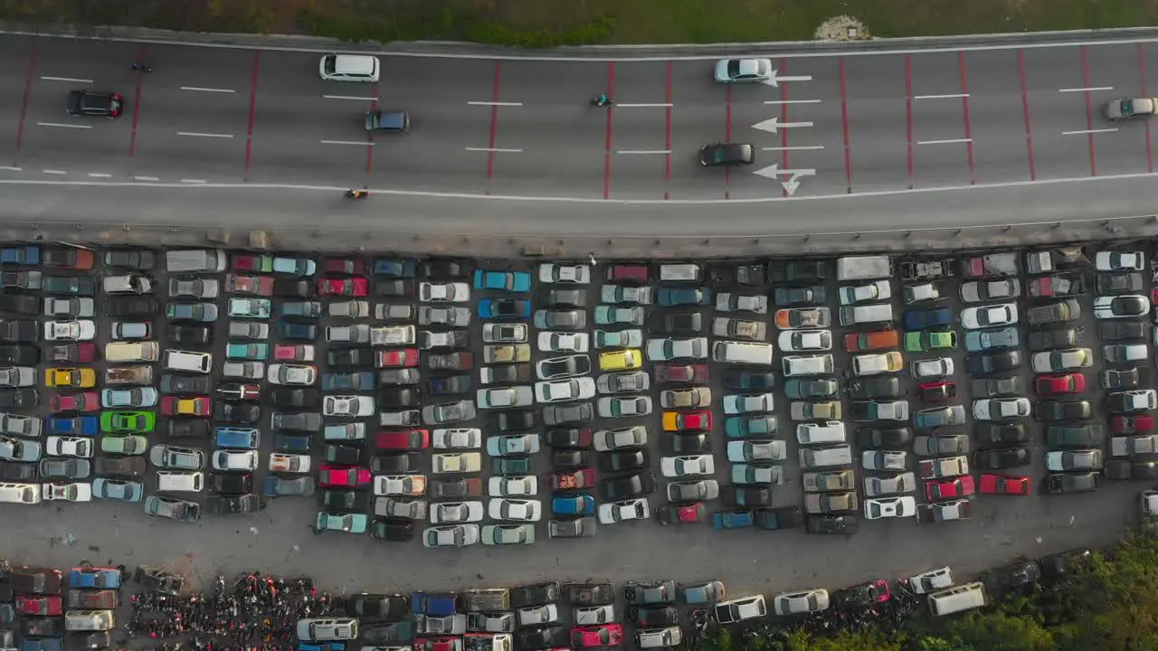 Junkyard with old broken cars next to highway at Kuala lumpur aerial