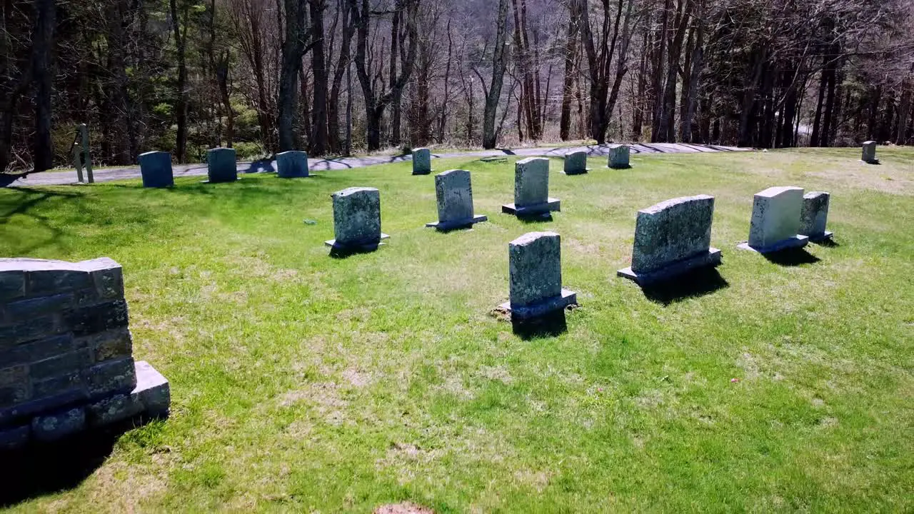 Slow aerial pull tombstones in north carolina graveyard