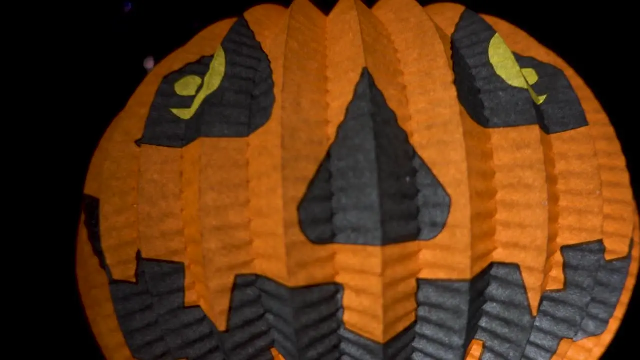 Halloween Pumpkin Paper Lantern The Jack O' Lantern Paper Lantern in the darkness one tipical decoration for halloween party or spooky decorating for trick or treaters