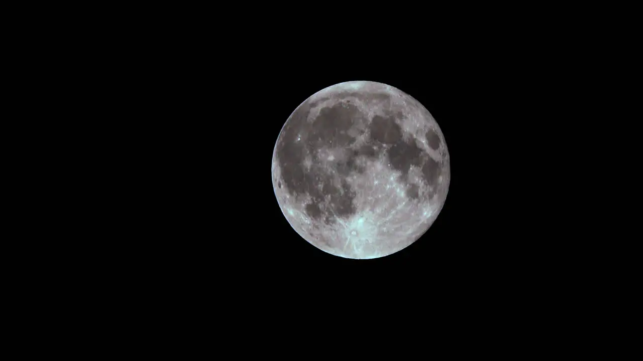 The full moon with craters and lunar maria clearly seen