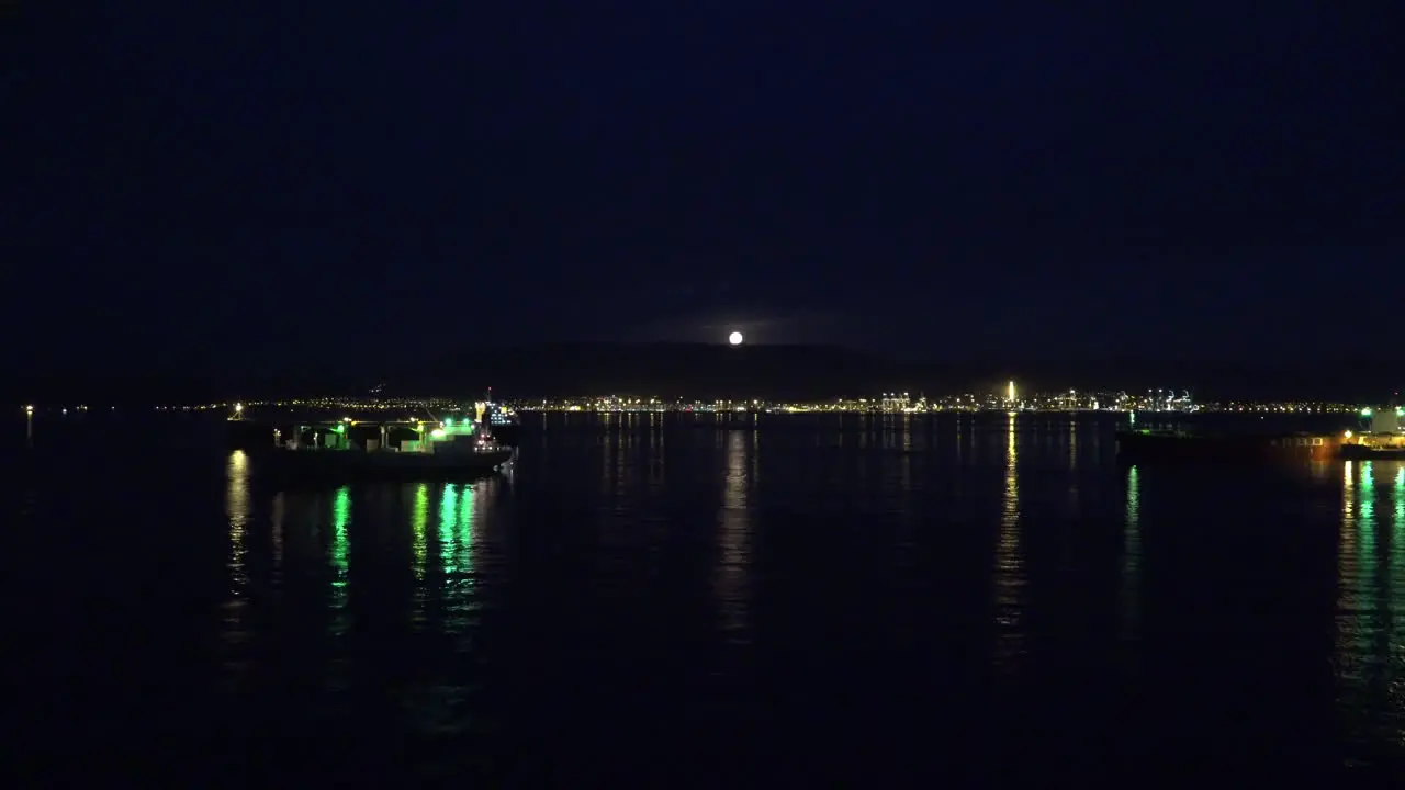 Gibraltar Moon Heading Under Cloud Zoom In