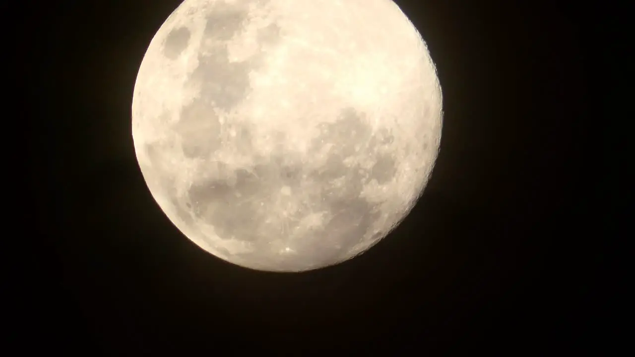 Timelapse video of a bright full moon at night time from the southern hemisphere