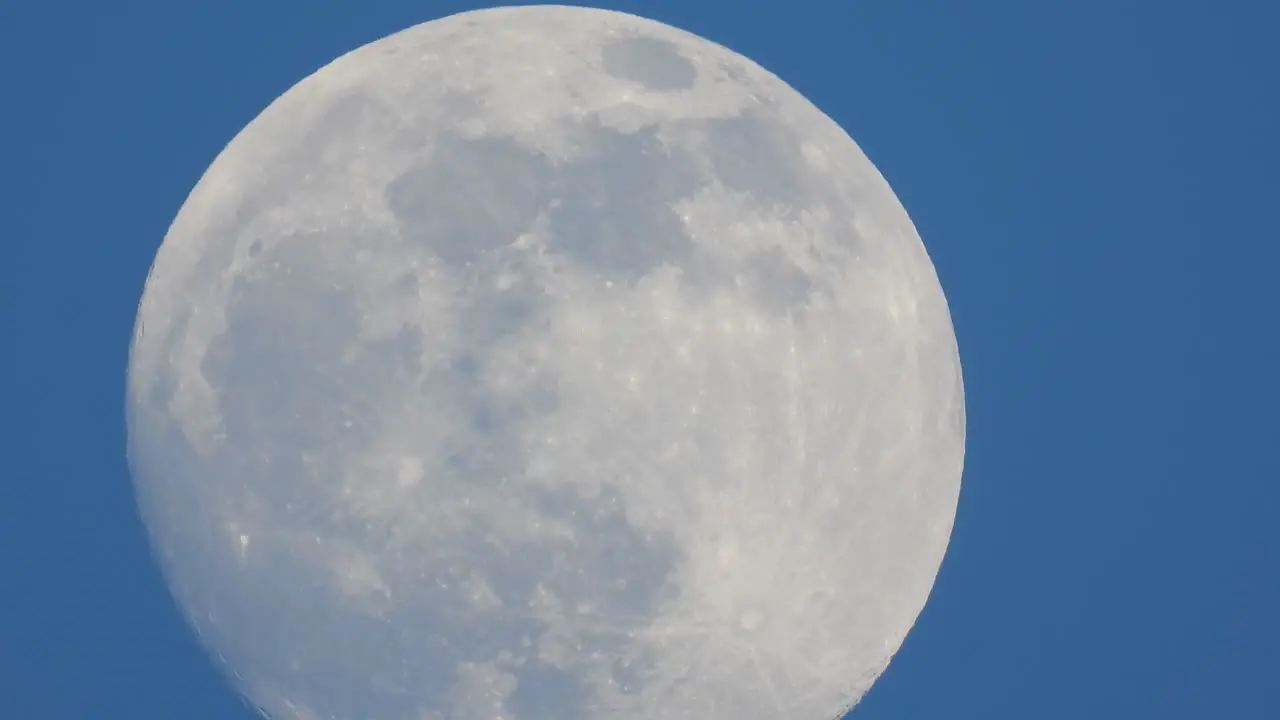 Tycho crater is visible on the Near side of the illuminated full moon surface