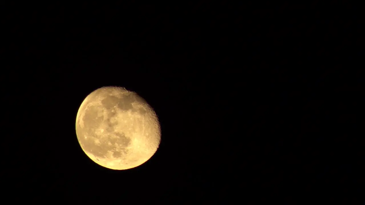 Time-Lapse Of A Third Quarter Moon Traveling From The Bottom Left Corner To The Top Right On A Clear Night