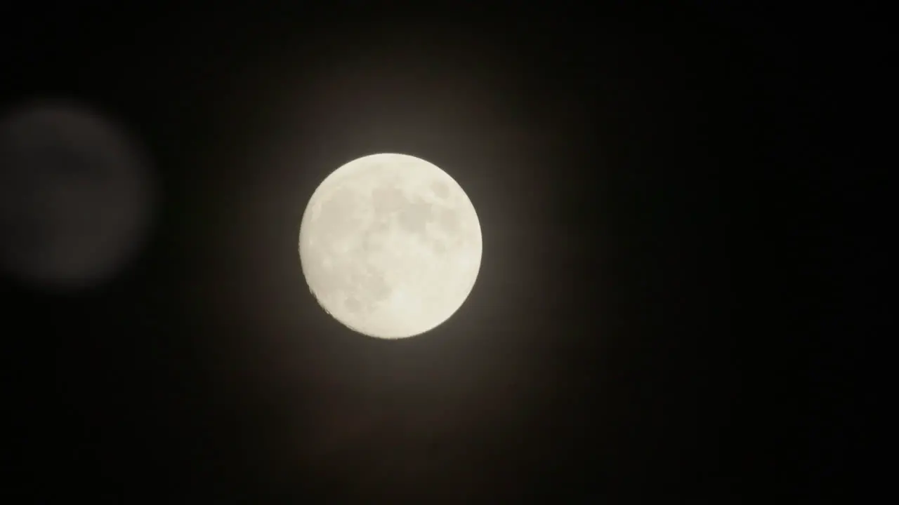 Full moon timelapse behind clouds