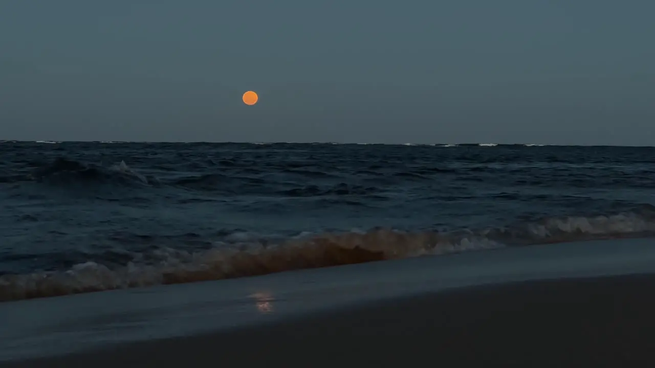 Moon rising over the sea beautiful scenic cinematic shot