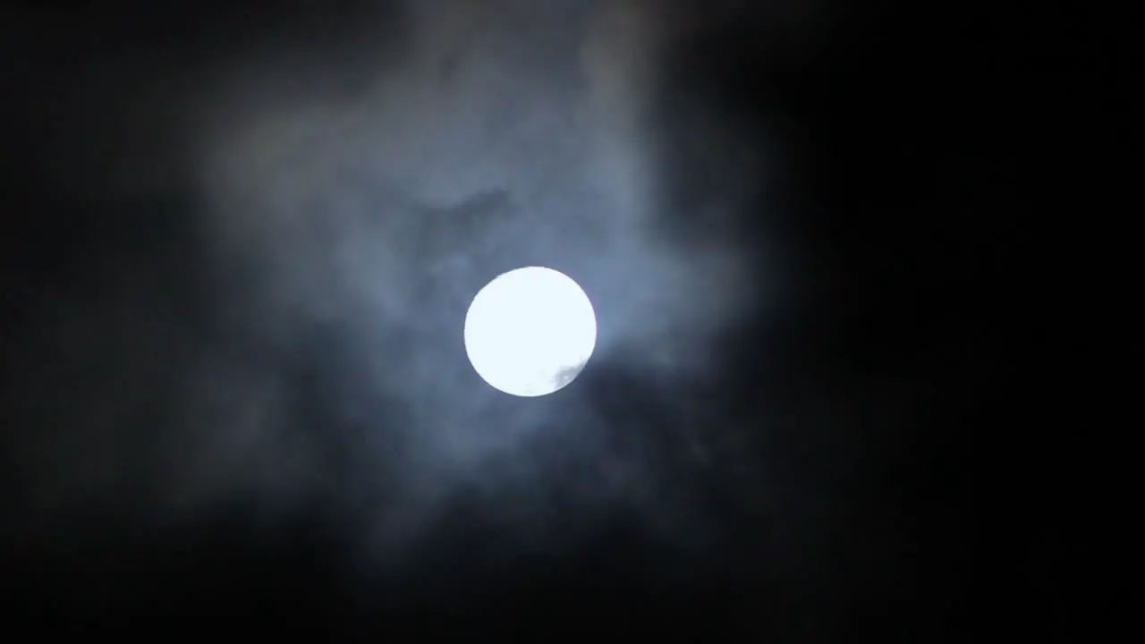 Creepy Clouds Over the Moon at Night