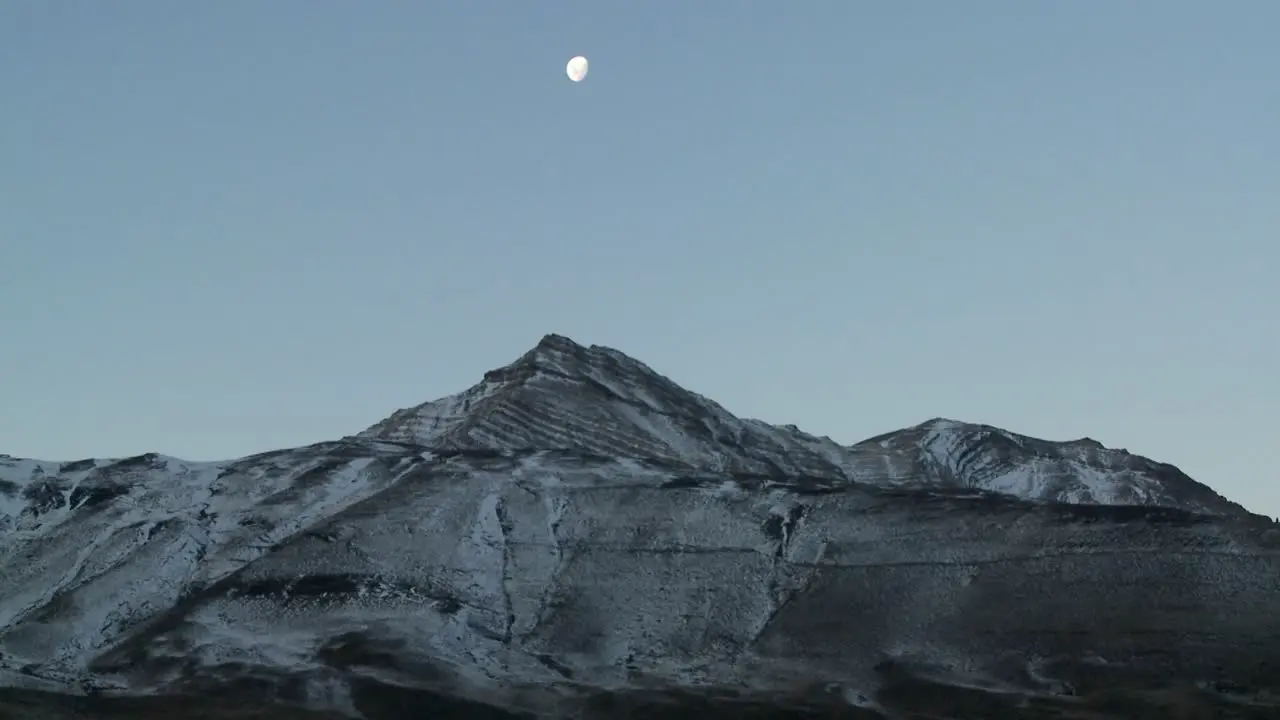 A full moon rises over the Andes mountains in Patagonia