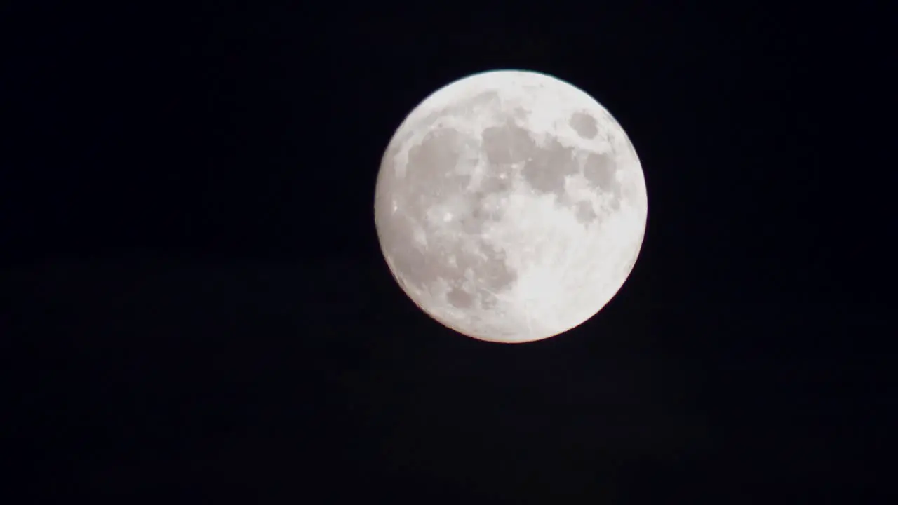 Full moon on the black night sky