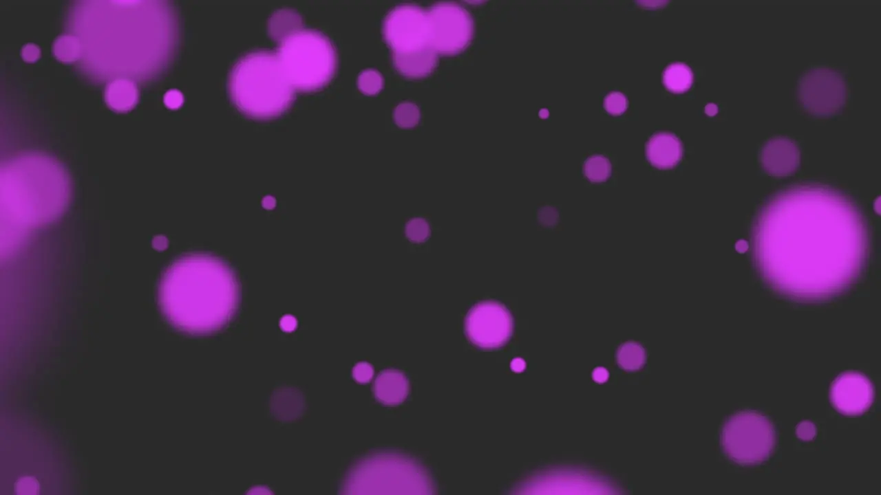 Flying purple round particles with glitters on fashion black gradient