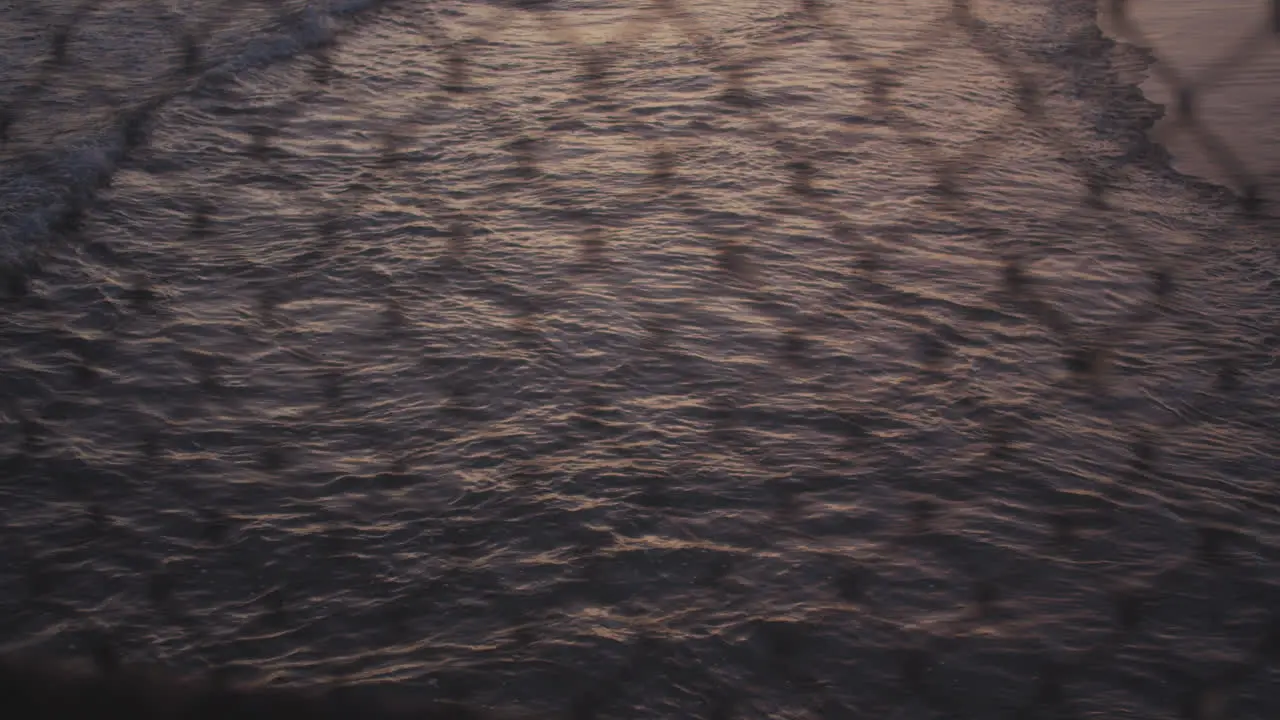 The Pacific through a chainlink fence