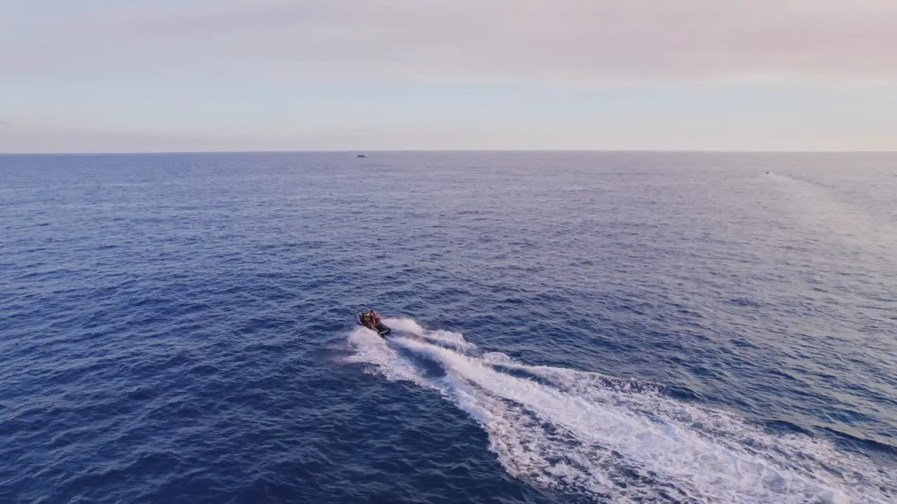 Dronefootage of following a jetski on the open water close to the coast