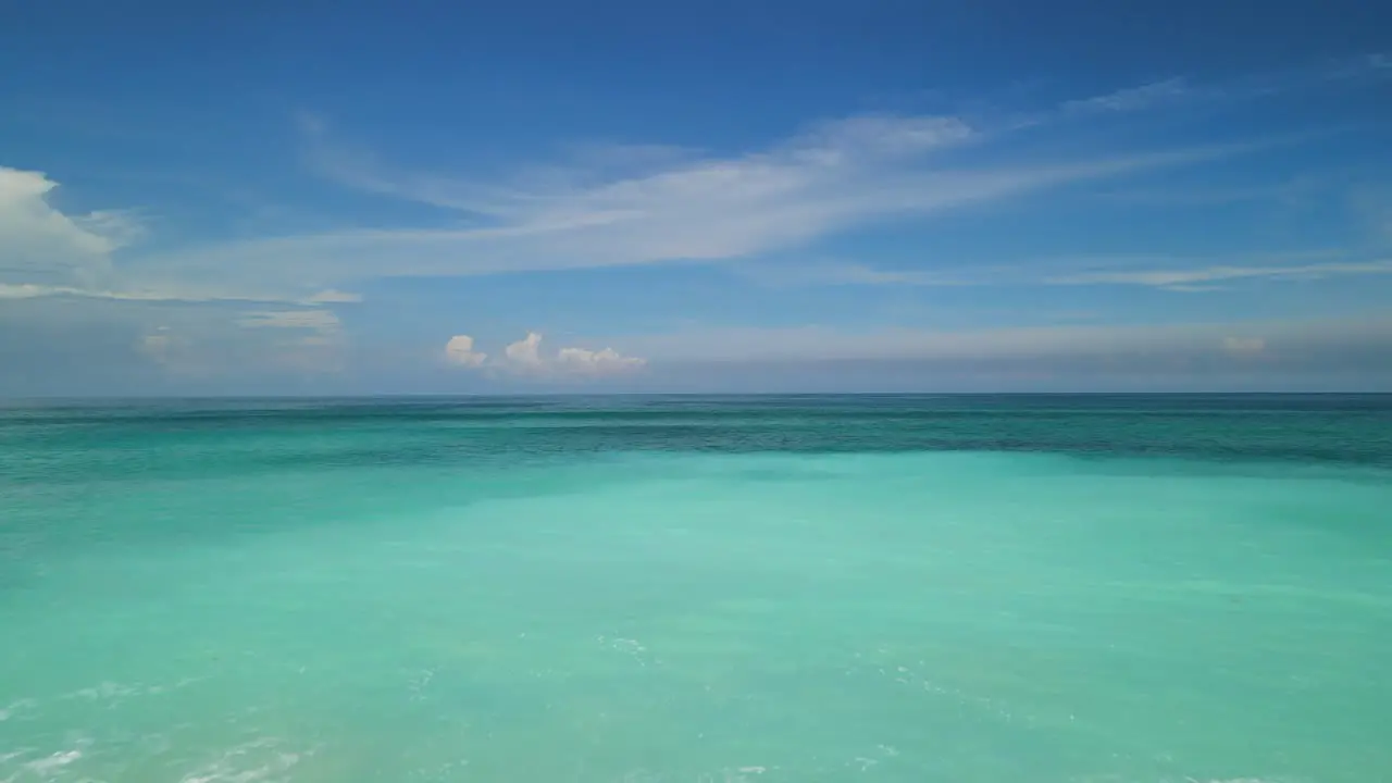 Men on the beautiful white sand beach Indonesia