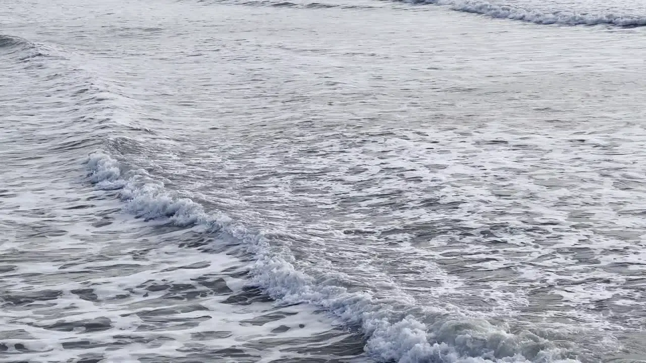 Early winter morning wave following on the ocean shores