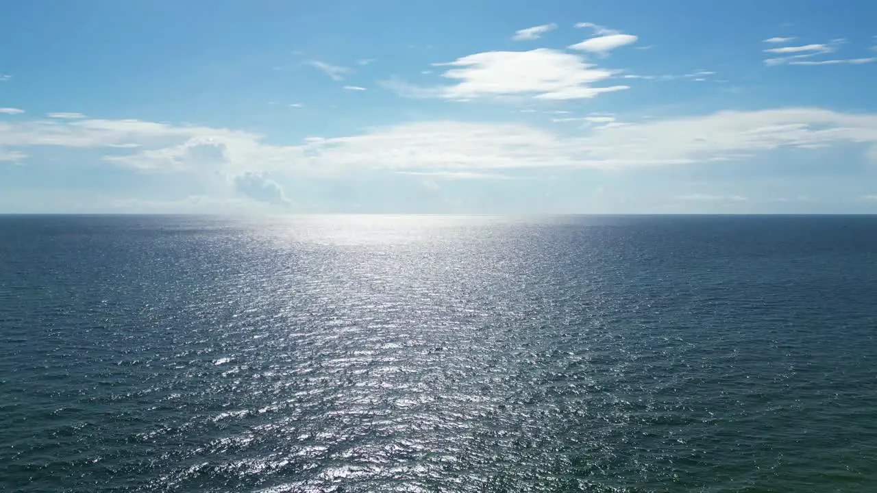 Rising drone shot looking at the ocean and horizon