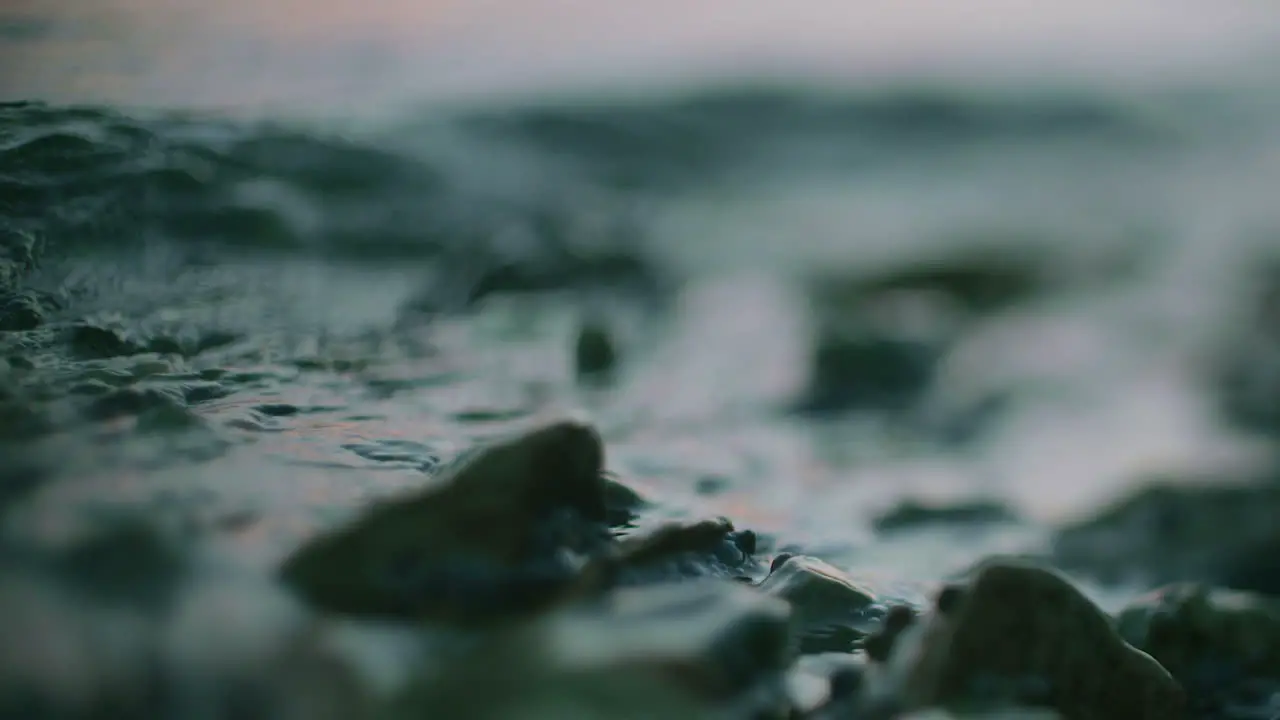 Blue Water Surface Waving Over Stone