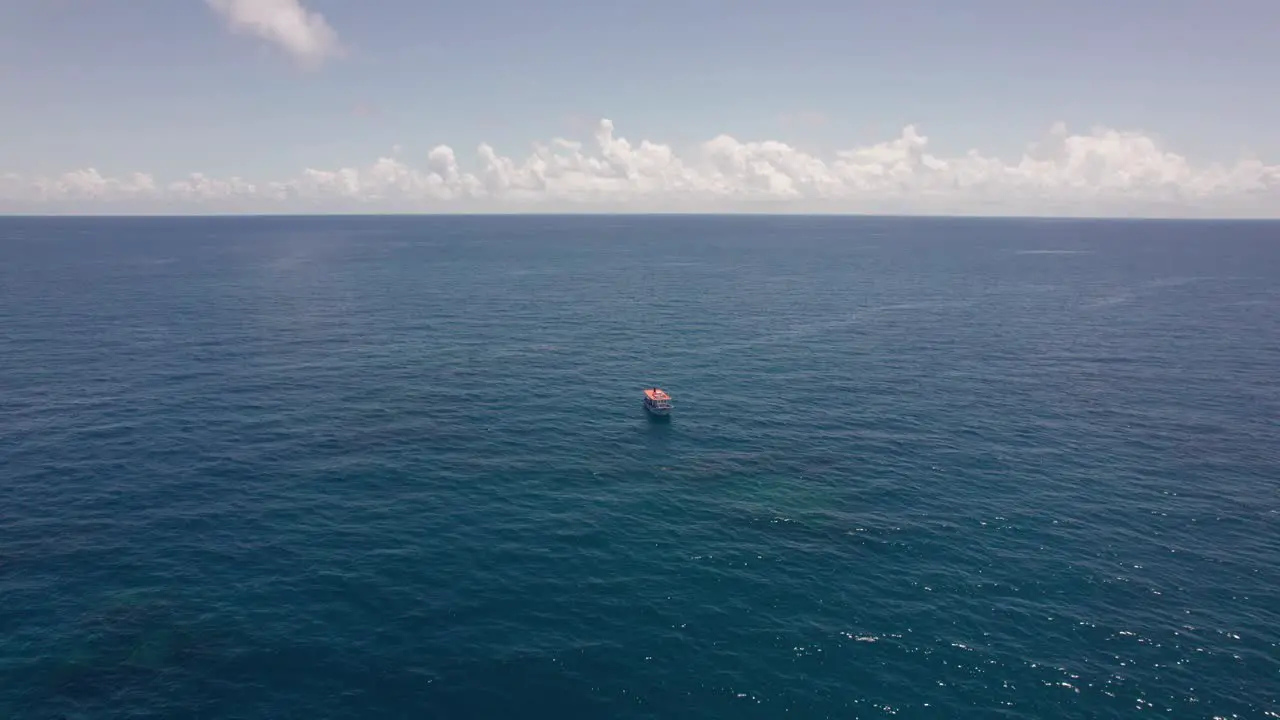 Blue ocean and a fishing boat