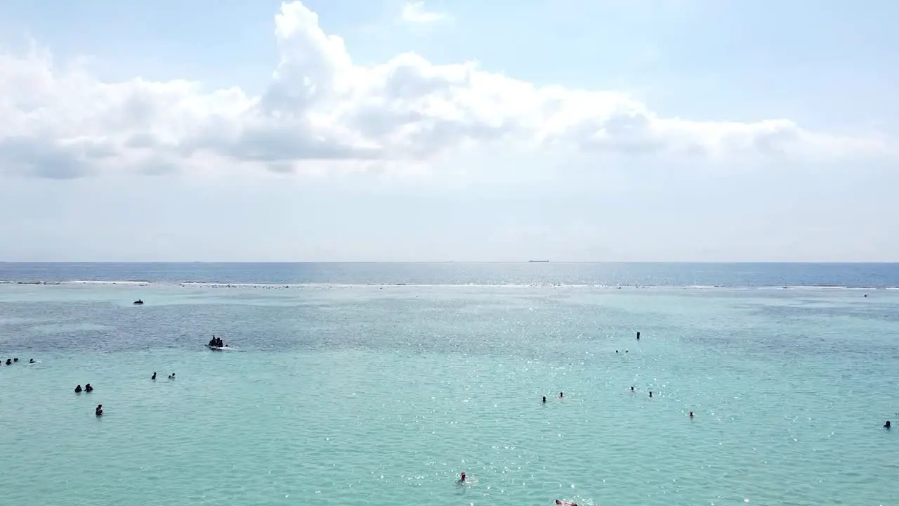 Drone flying over the sea showing Caribbean life in dominican republic boca chica Dominican republic