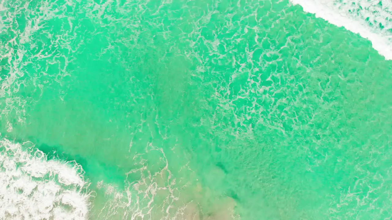 Orbit Shot Of Cool Waves Crashing On Sandy Beach Stunning Turquoise Water