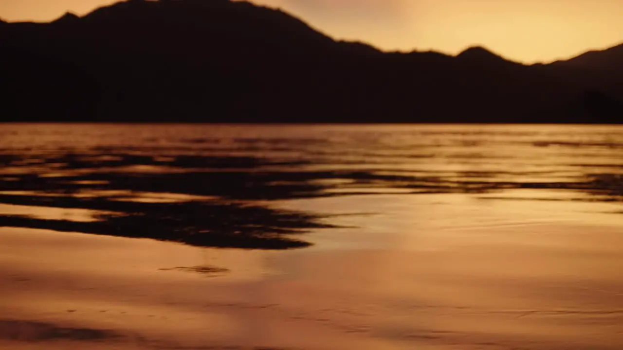 Close up shot of sea waving by the wind during the sunset time in Indonesia