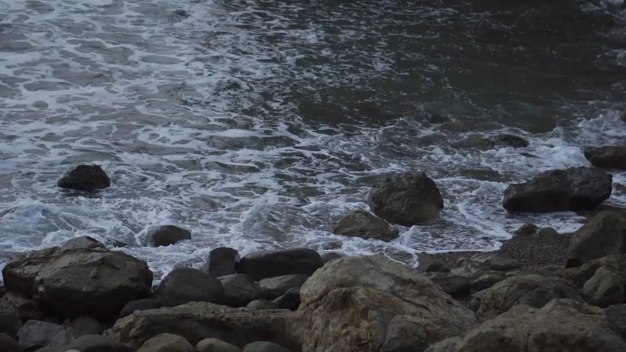 Calming Waves Crashing Against Large Rocks