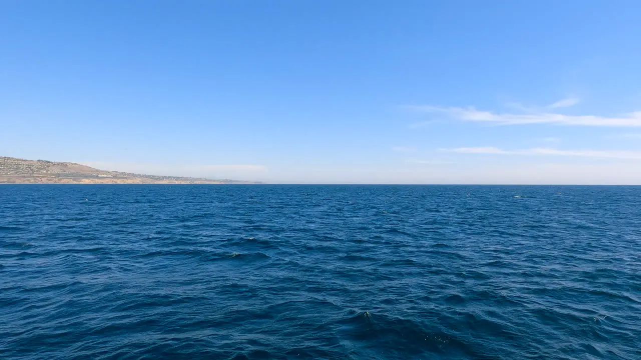 Flying fast just over the surface of the Pacific Ocean off the coast of Southern California