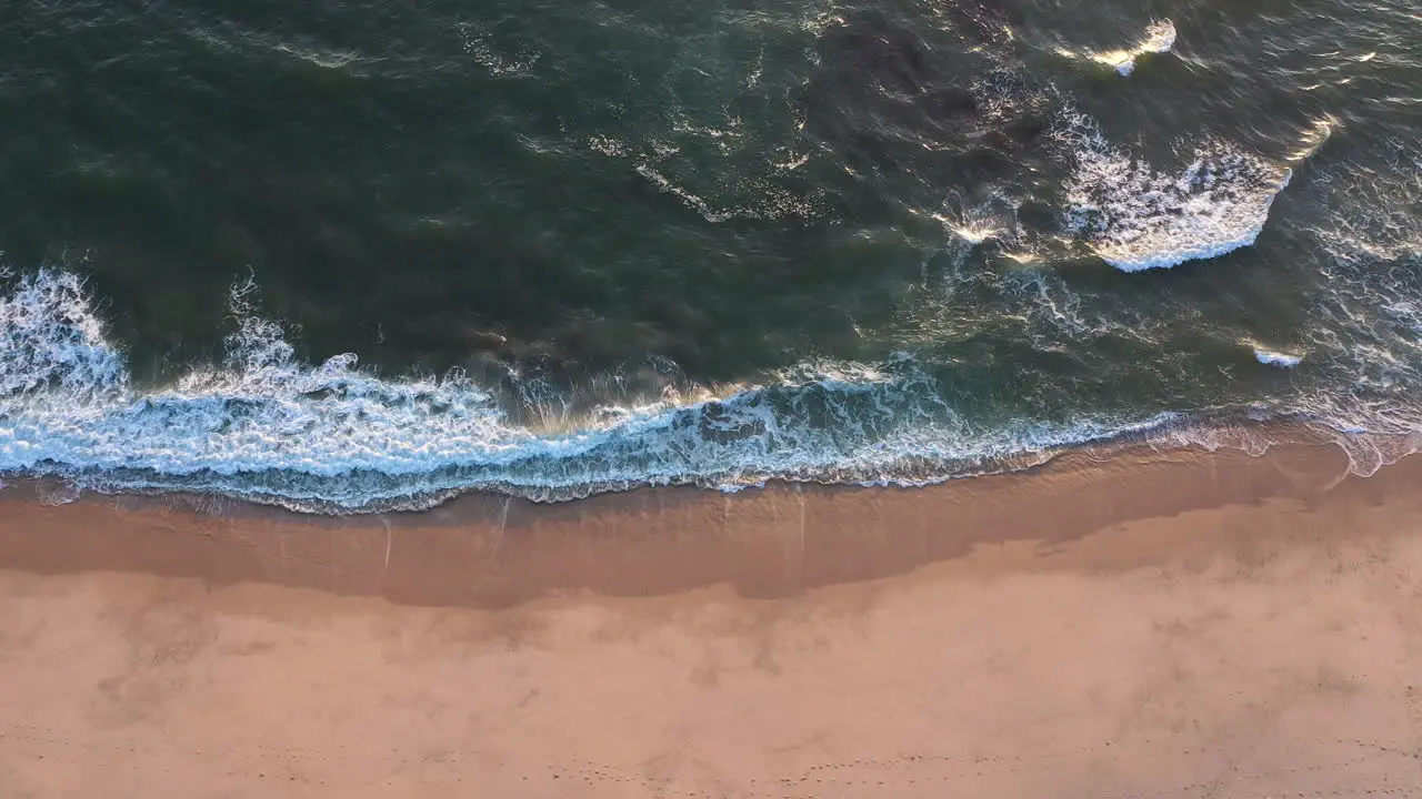 Beach top horizontal view of waves hitting the shoreline