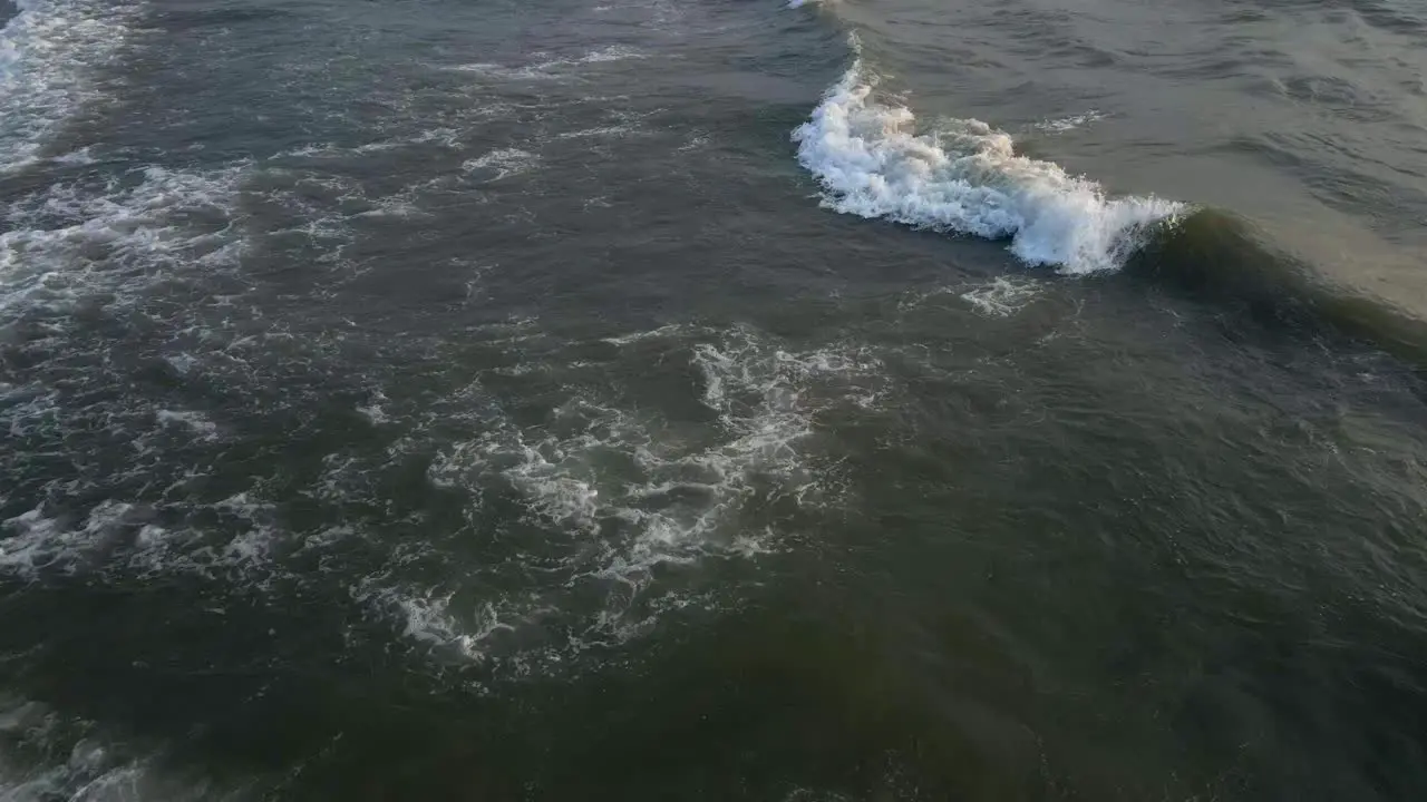 sunset waves peaceful India goa beach drone shot