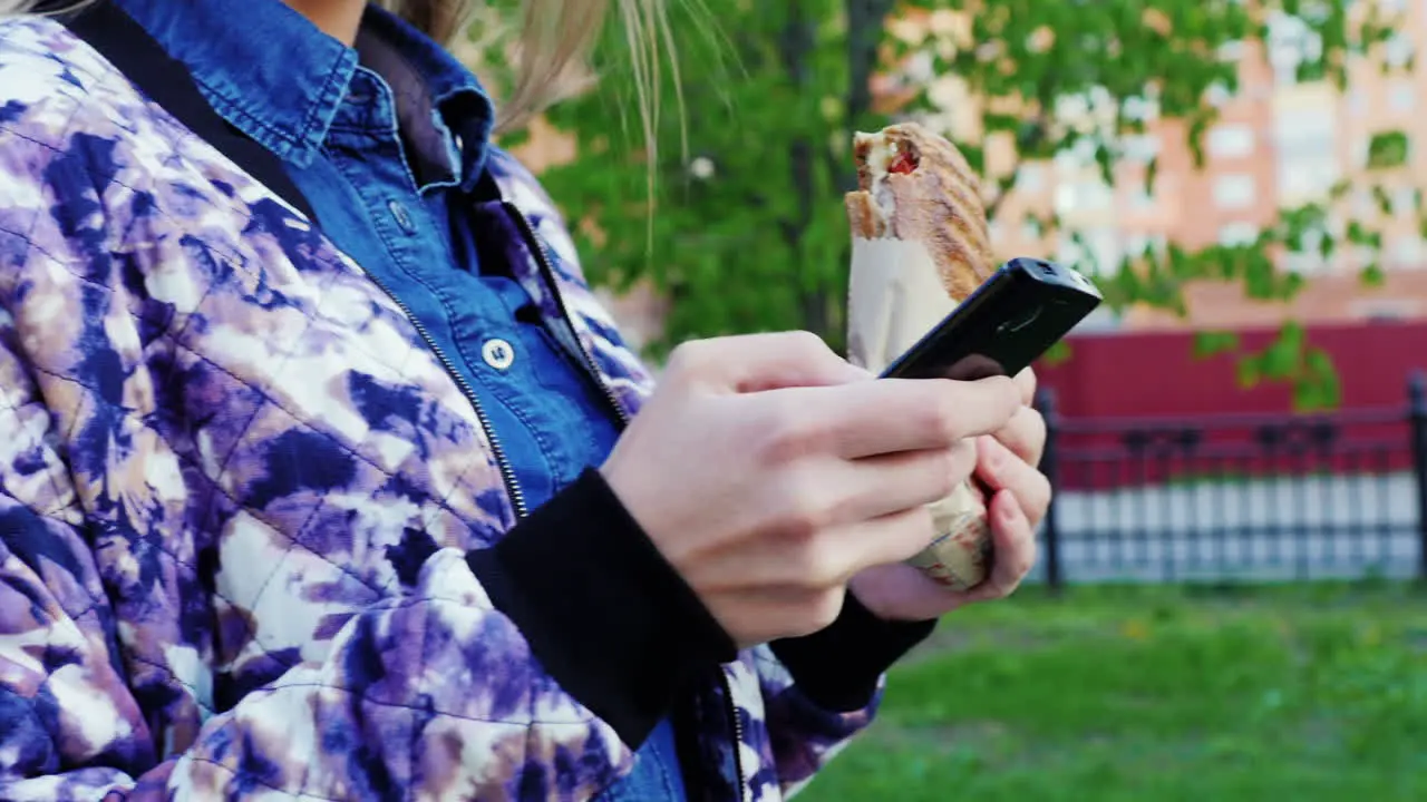 Attractive Woman Walking In The City Enjoys A Smartphone Prores 422 10 Bit