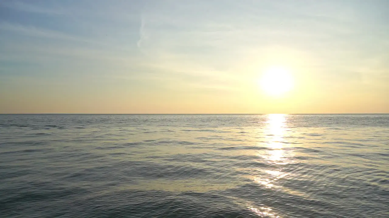 Golden Hour Sunlight Above Horizon of Tropical Sea