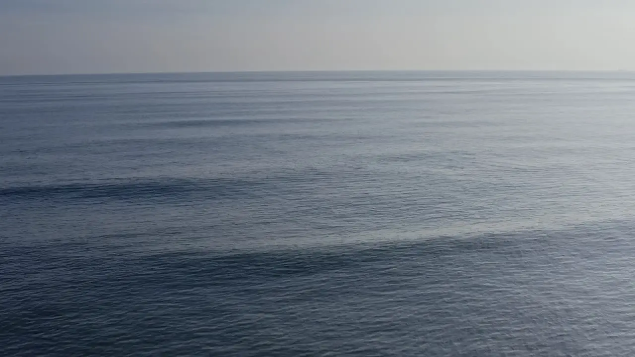 Beautiful deep-water wave moving to shore at sunset ocean water patterns