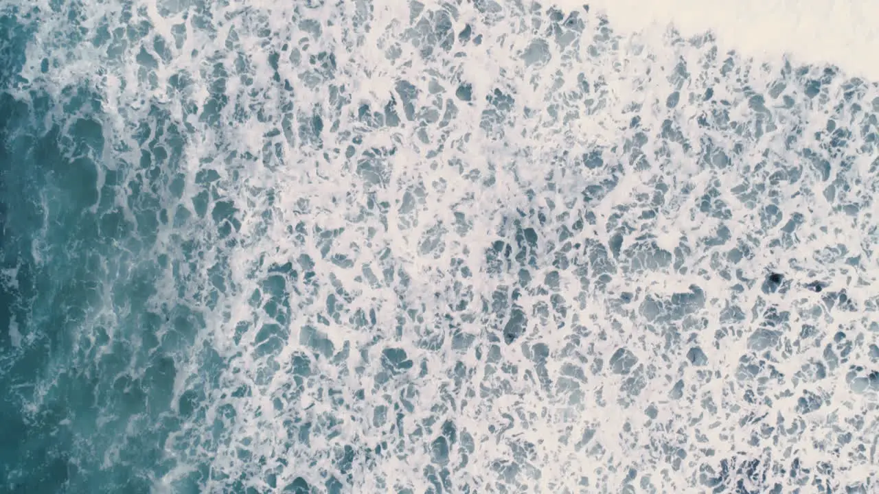 Wave and whitewash top down aerial