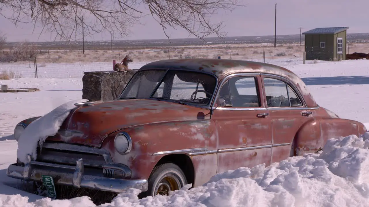 An old abandoned Cadillac in Atomic City Idaho on a cold winter day