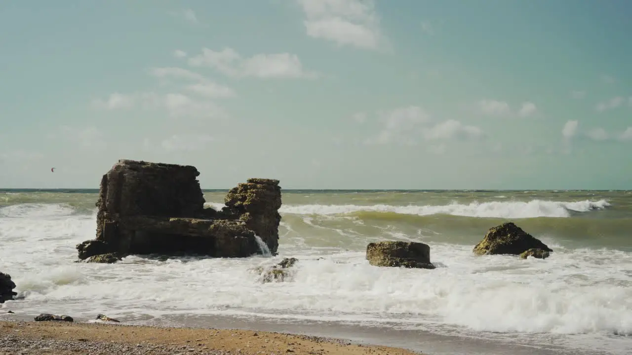 Sea Waves Crashing into Rocks on the Beach