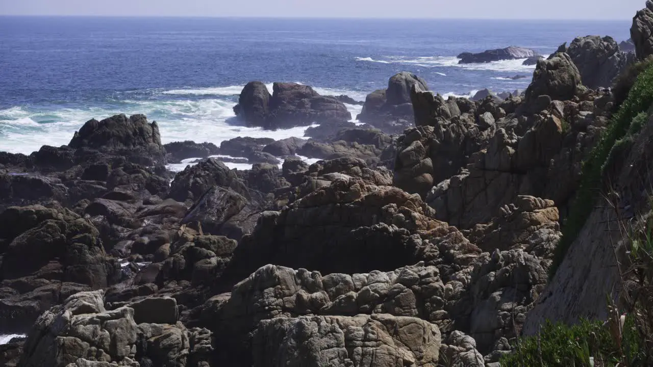 Ocean Waves Crashing Against Rocks At Summer