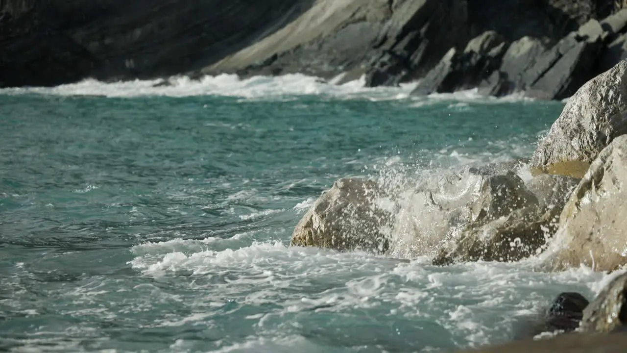 Ocean Waves Breaking Against The Rocks And Shoreline Of Italy