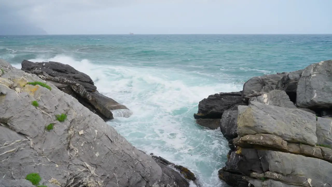 Rocks and crashing waves in Mediterranean Sea