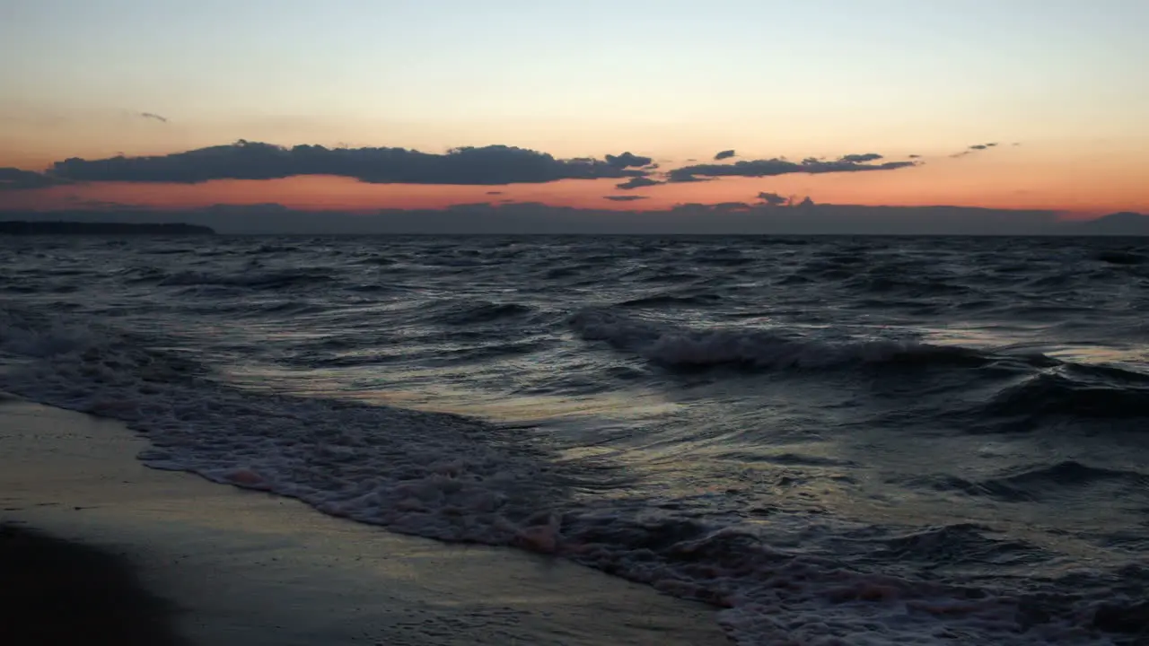 Scene of strong sea surf at sunset