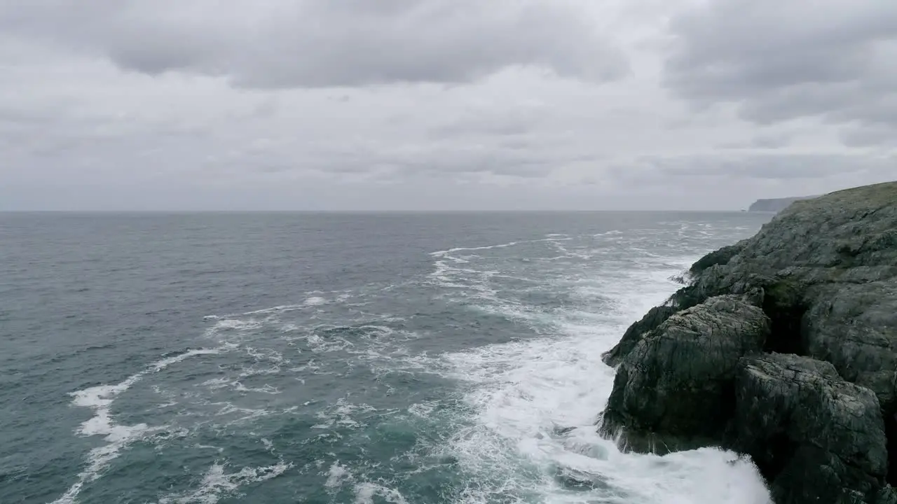 Aerial tracking over a rocky coastline out in the north sea