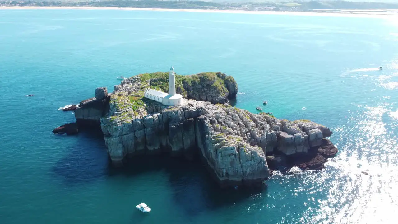 Beautiful Lighthouse on an island with blue waters on a sunny day