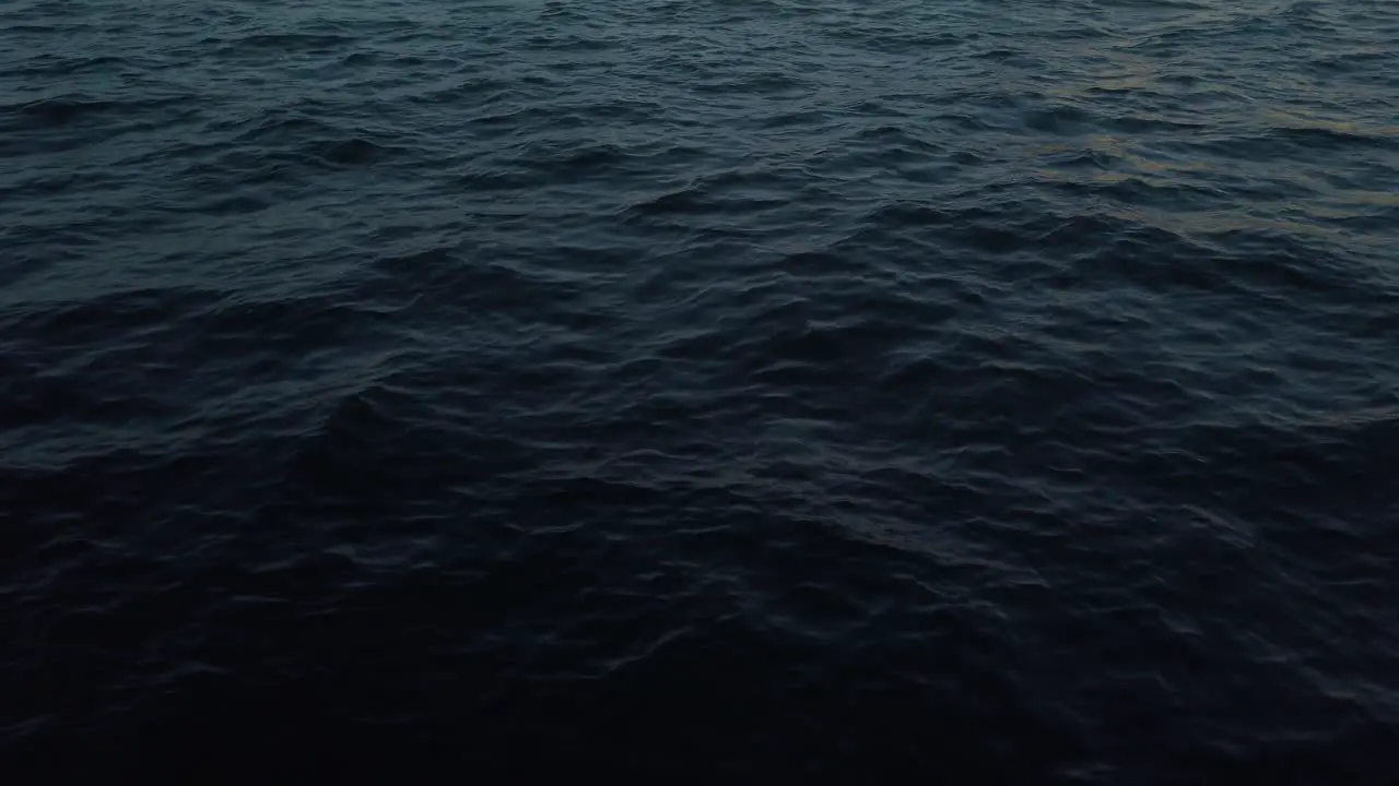 Waves On A Deep Blue Ocean At Dusk During Summer