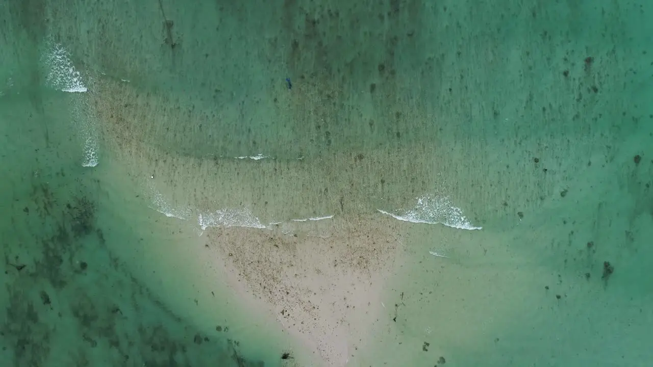 The beautiful refreshing waves of Thailand over a shallow beach top view