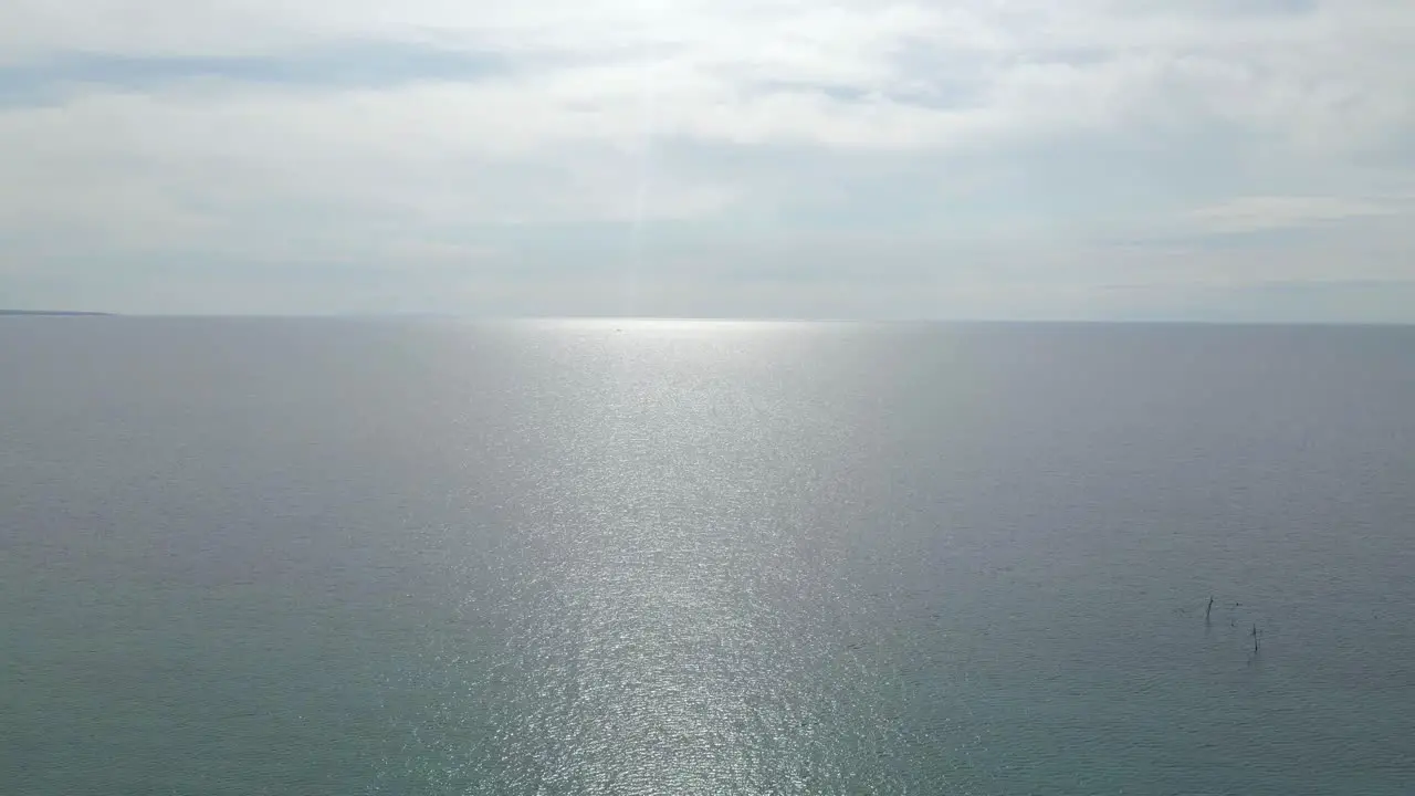 4k paning clip of the ocean over a peninsula on the tropical beach of Epanomi Halkidiki Greece