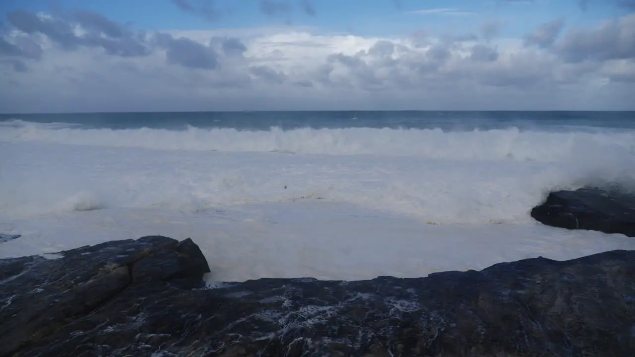 Beautiful white waves splashing on rocks Clovelly Cliff Sydney Australia