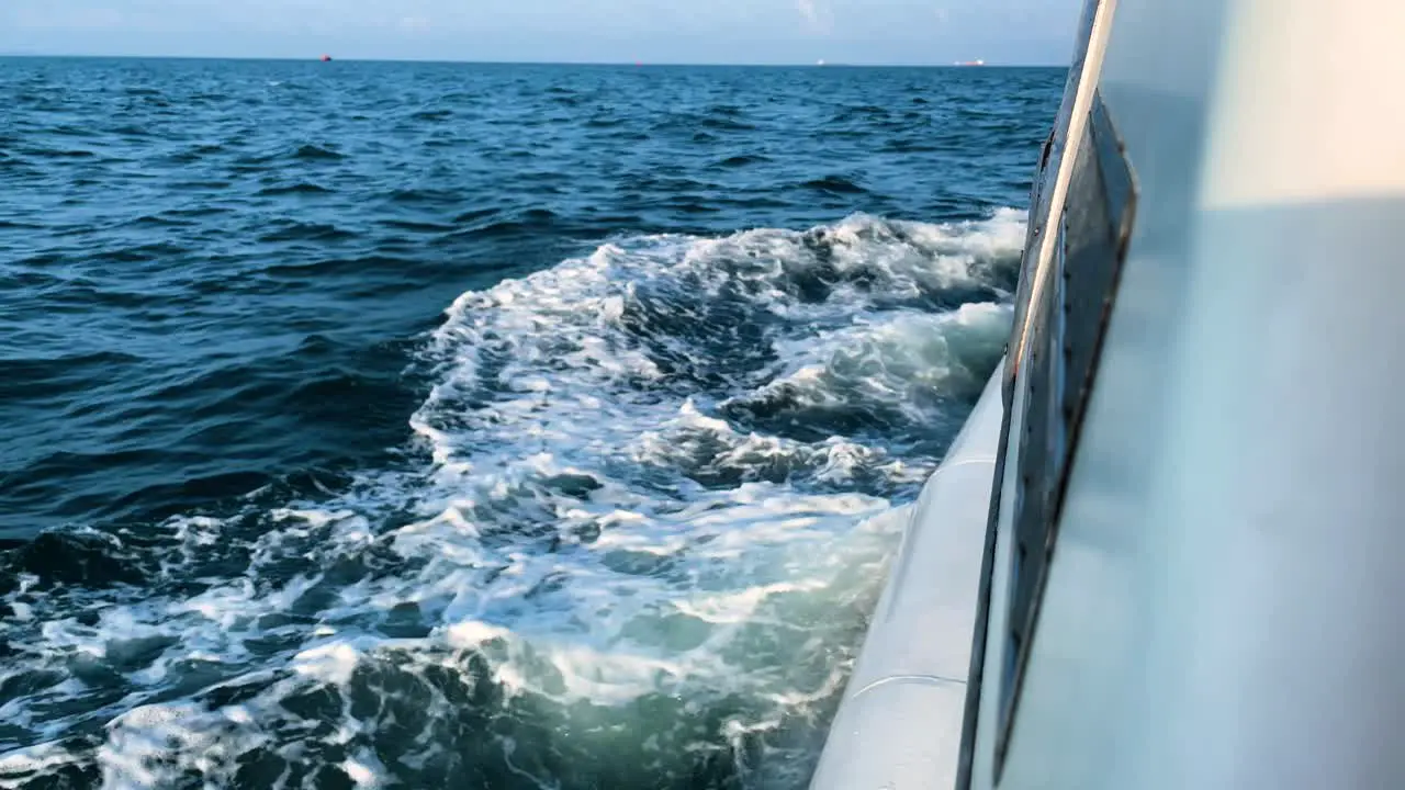 Waves splashing at the side of the boat -Ocean adventure -Close up