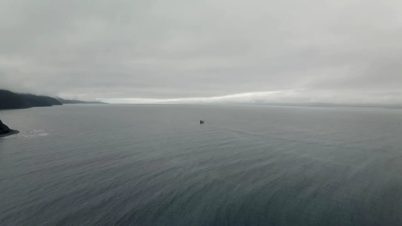 Fishing Boat Floating On The Calm Sea On A Foggy Day In Quebec Canada