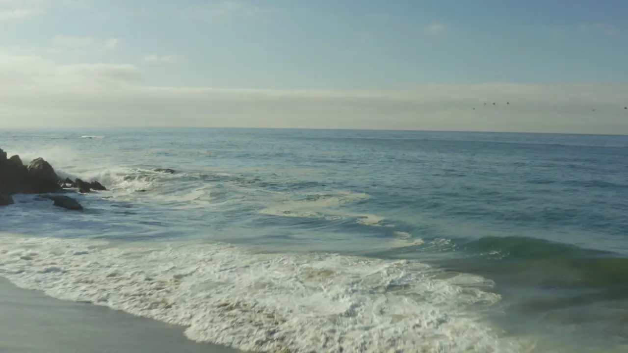 Tilt shot view of beautiful beach with cliff