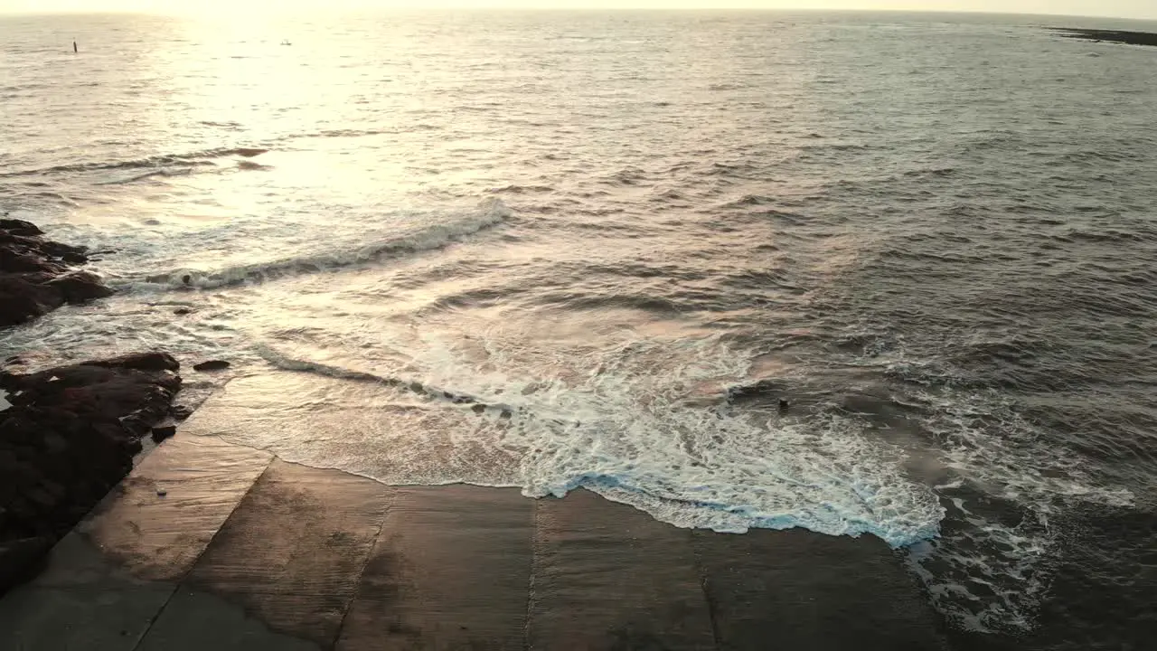 gorai beach dock waves on sun set dron shot